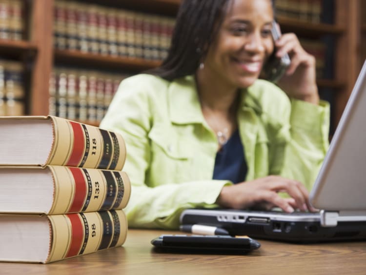 Female paralegal working in library