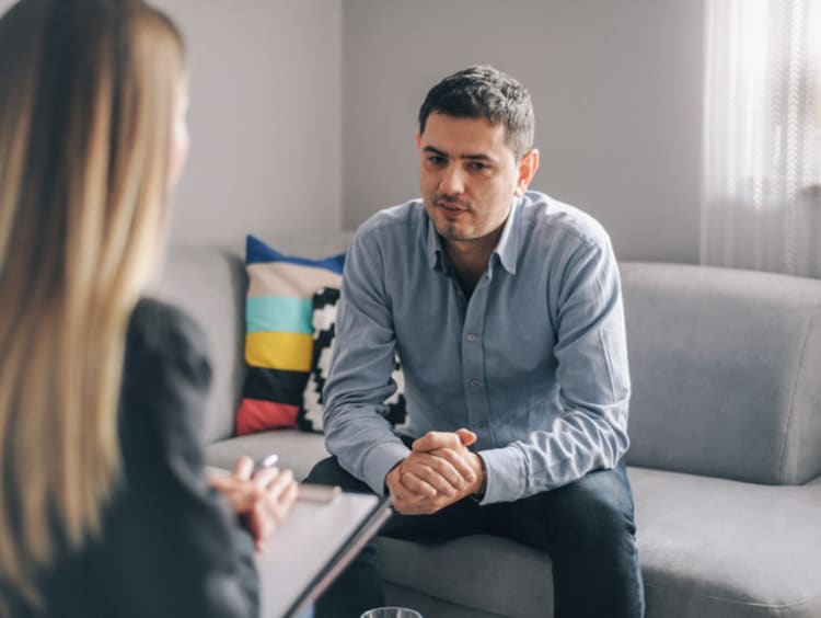 female mental health counselor meeting with male client