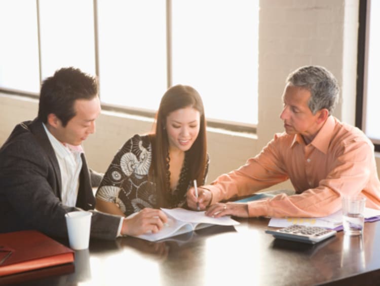 Case manager helping a couple with paperwork