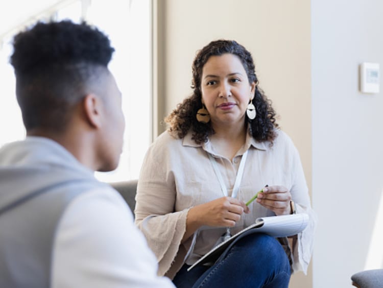 Counselor with student in office