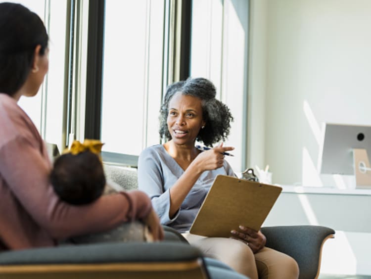 Counselor talking with young mother