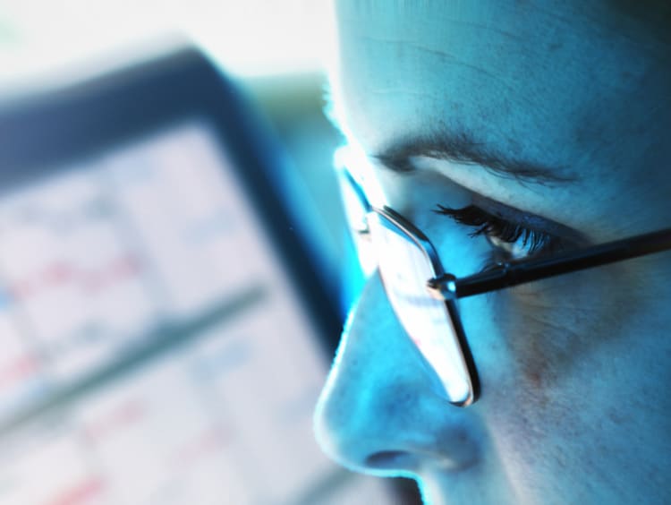 close-up of woman looking at computer in office