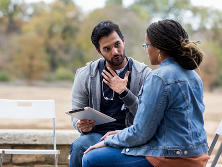 Psychiatric technician asking patient questions