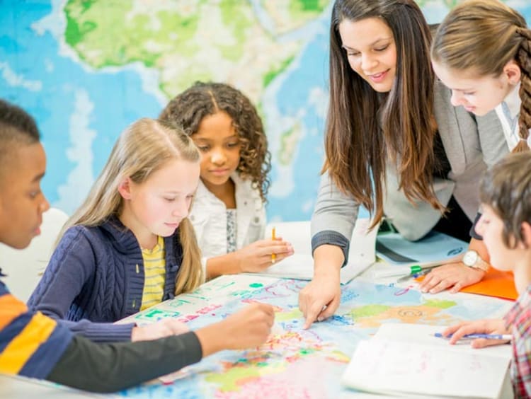 Woman teaching students geography