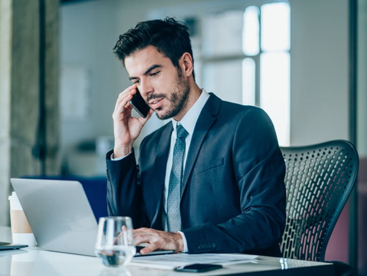 Businessman making a phone call in a conference room