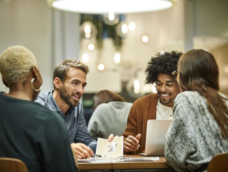 Coworkers at table working with purpose