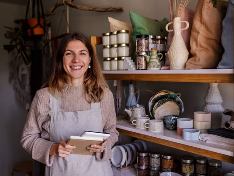 Female entrepreneur taking inventory in her store