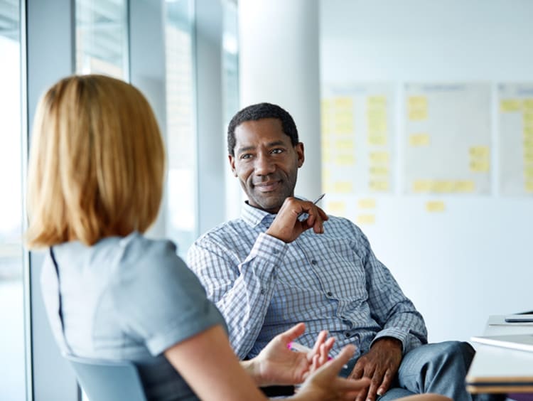 Human resources specialist talking to employee