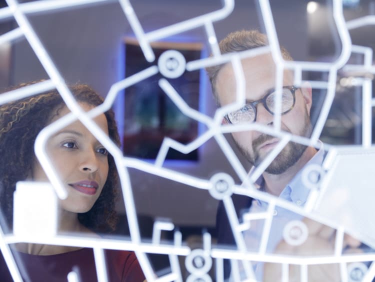 Professionals looking at futuristic display