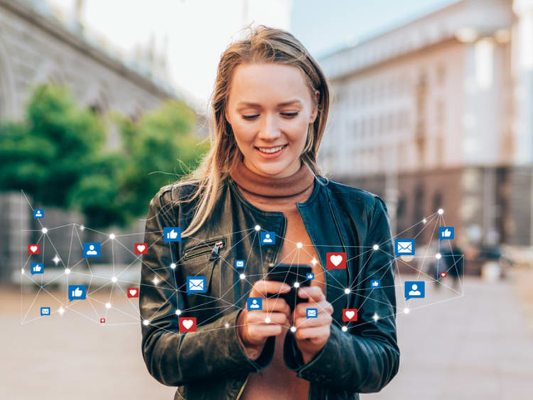 female marketing manager working on her phone