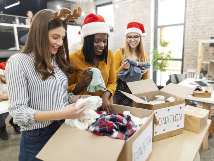 Coworkers collecting donations at Christmas