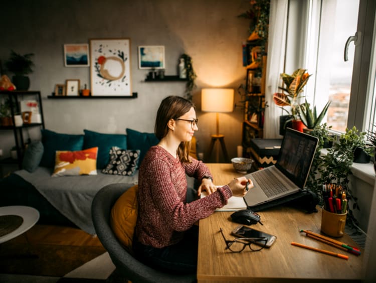 Woman working remotely from home office