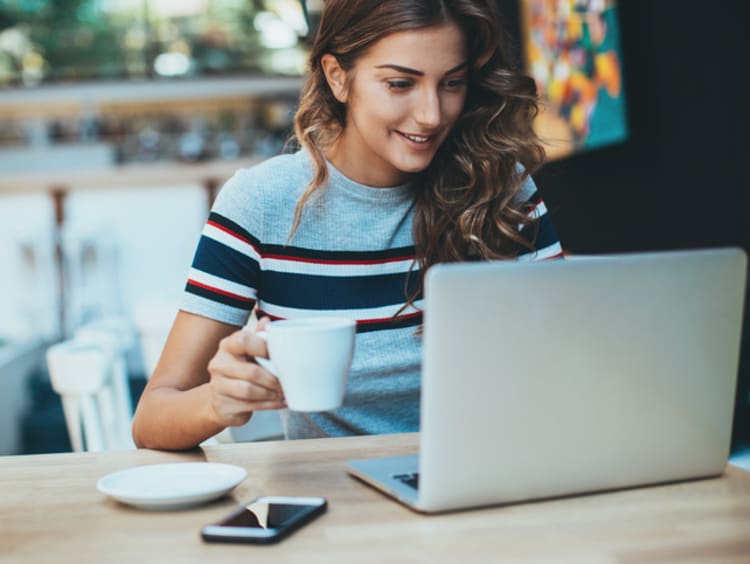 remote worker starting her day at her laptop