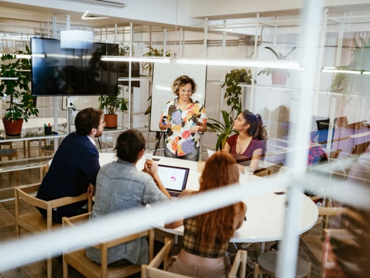 Woman leading a team of businesspeople