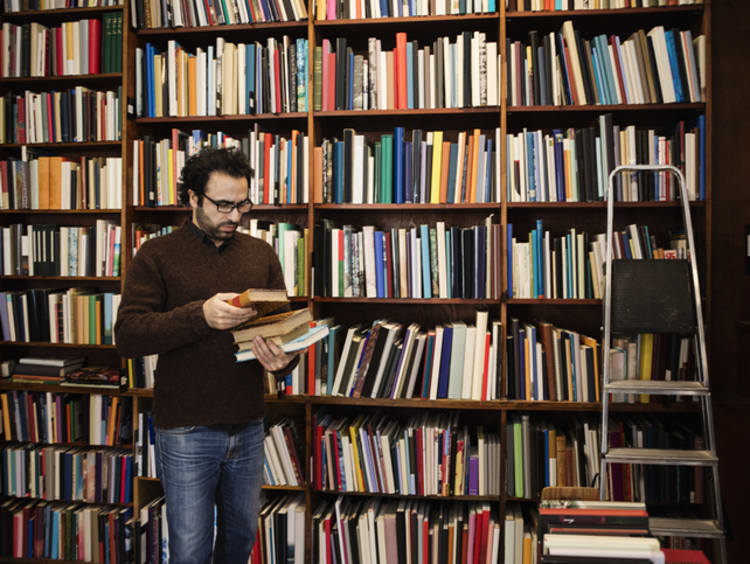 Doctoral student reading book in library