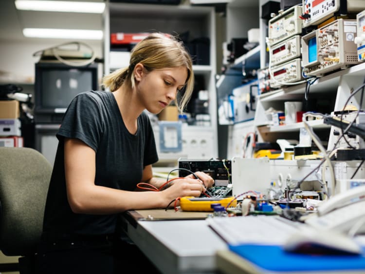 Girl working at a desk in a lab