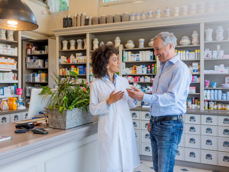 Pharmacist discusses a medical product with a patient