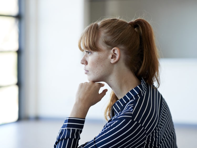 a young woman critical thinking about her college classes