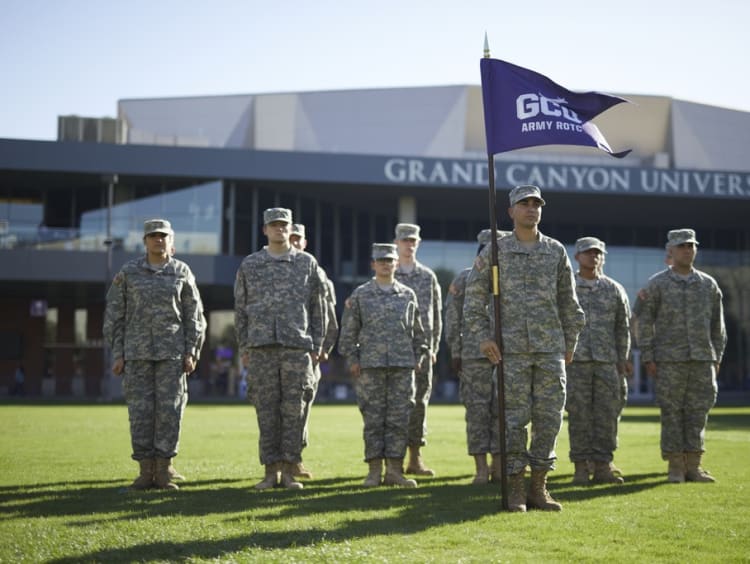 army students standing in front of the GCU Arena