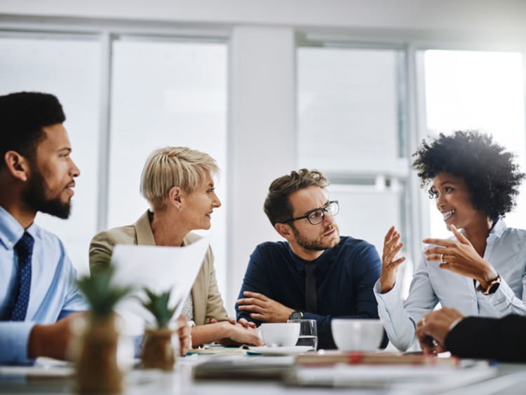 a team of people communicating at work during a meeting