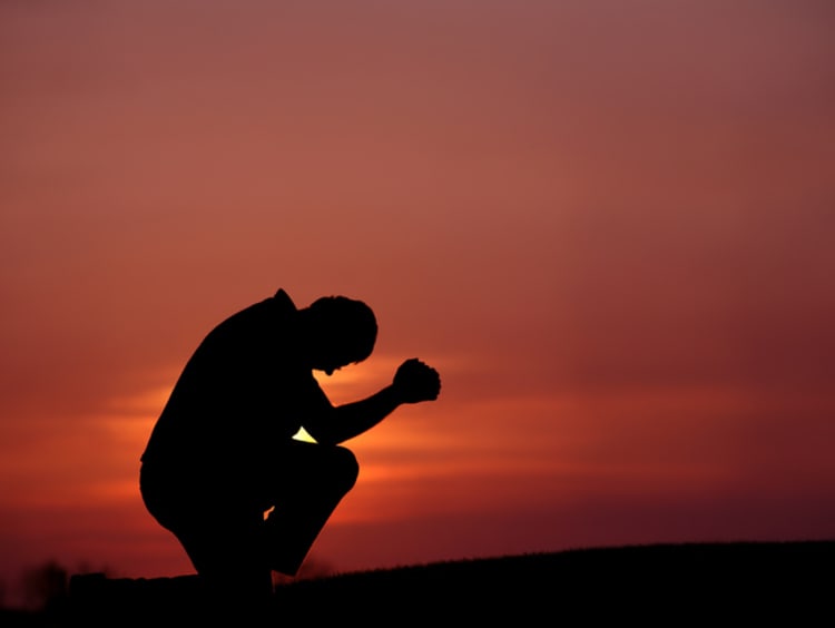 Man praying in the name of God 