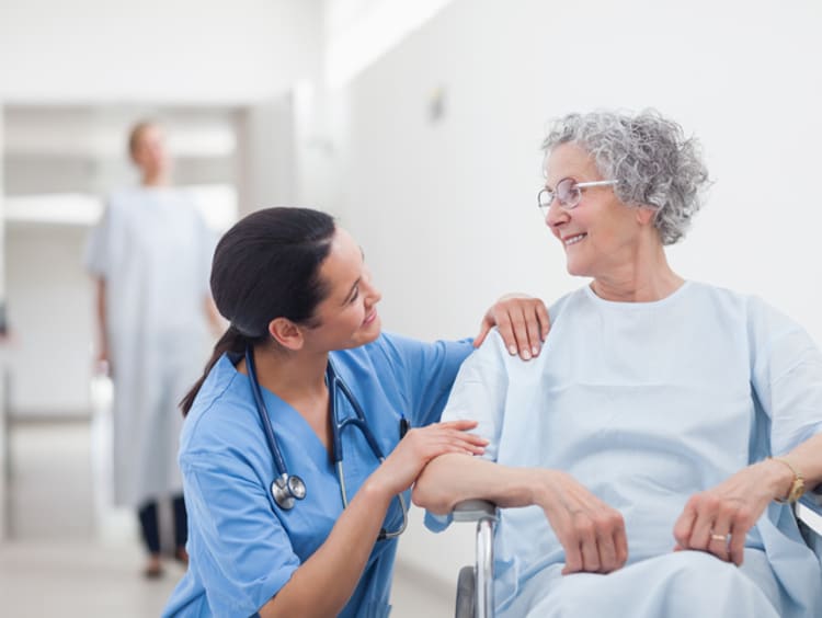 An adult-gerontology acute care nurse practitioner with an elderly patient
