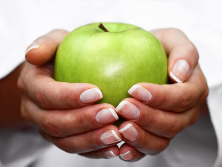 Dietitian holding apple