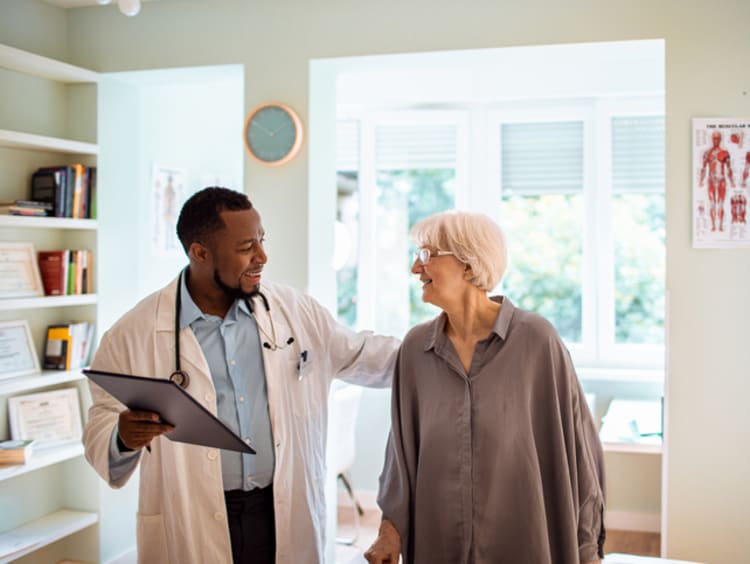 Geriatrician with elderly patient