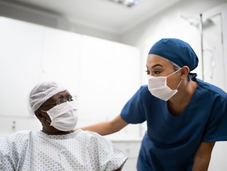 Nurse encouraging patient during a nursing intervention