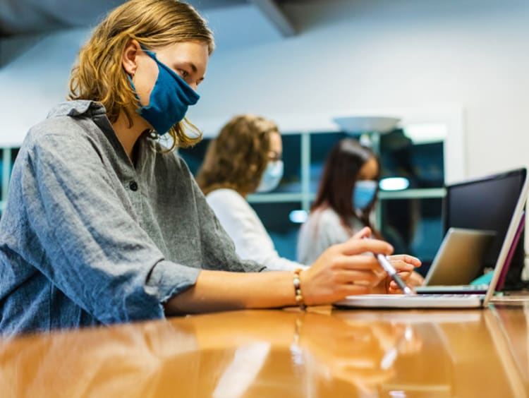 female nursing student studying for NCLEX exam