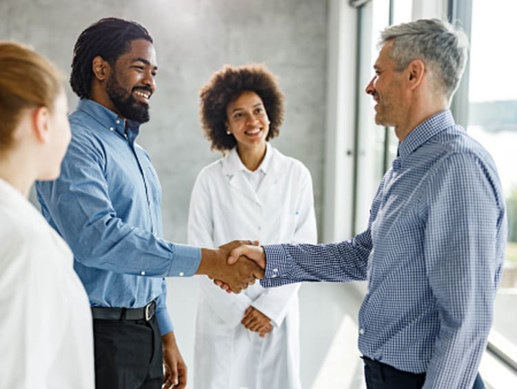 Healthcare administrators shaking hands 