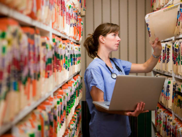 Healthcare professional looking at files