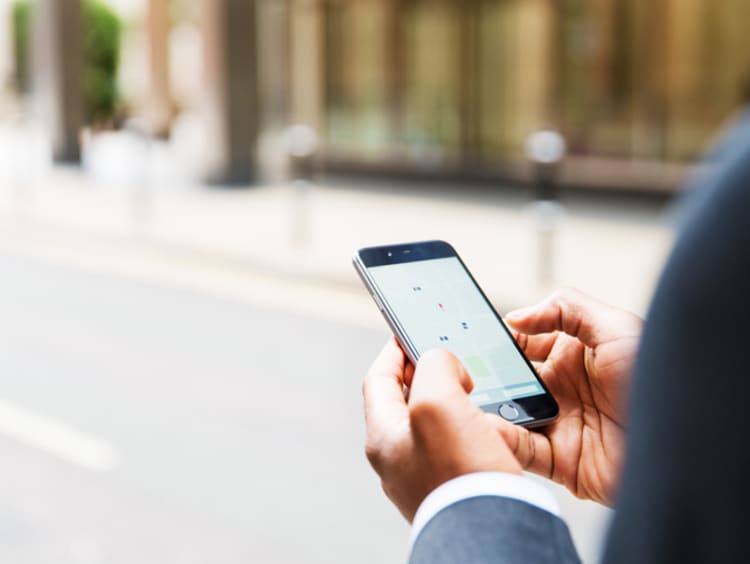 Man looking at apps on his phone