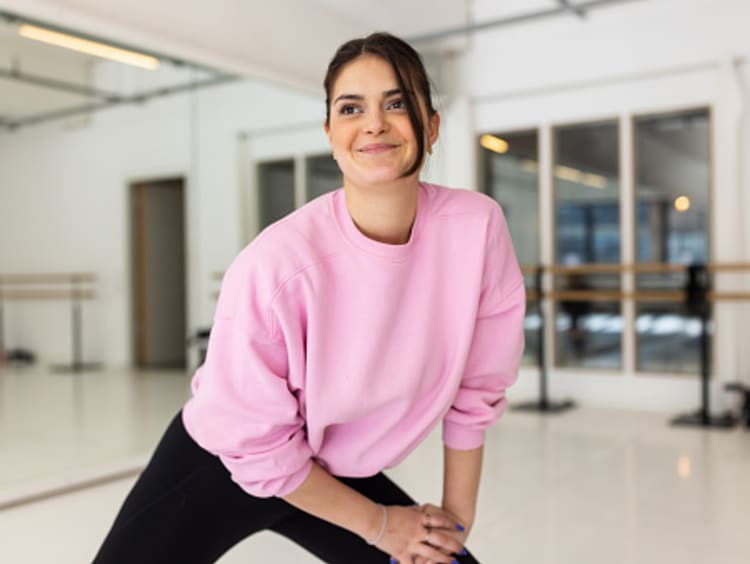 Gym, portrait or Indian girl stretching legs for workout routine or body  movement for active fitness. Healthy, athlete or happy woman smiling in  exercise training warm up for flexibility or mobility Stock