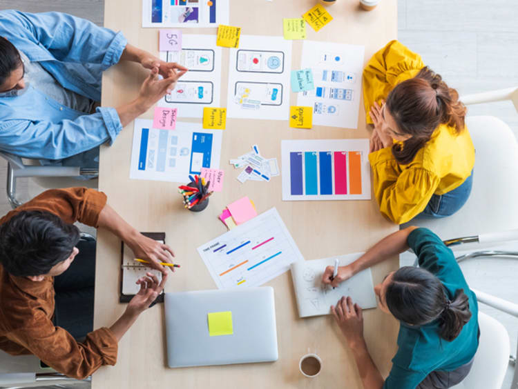 A group of web designer collaborating on designs