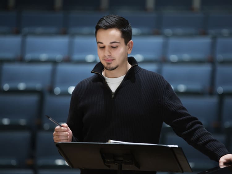 Musical director reading over music