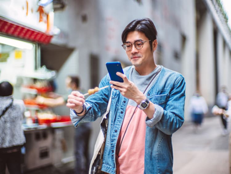 Social influencer taking photo of food for social media