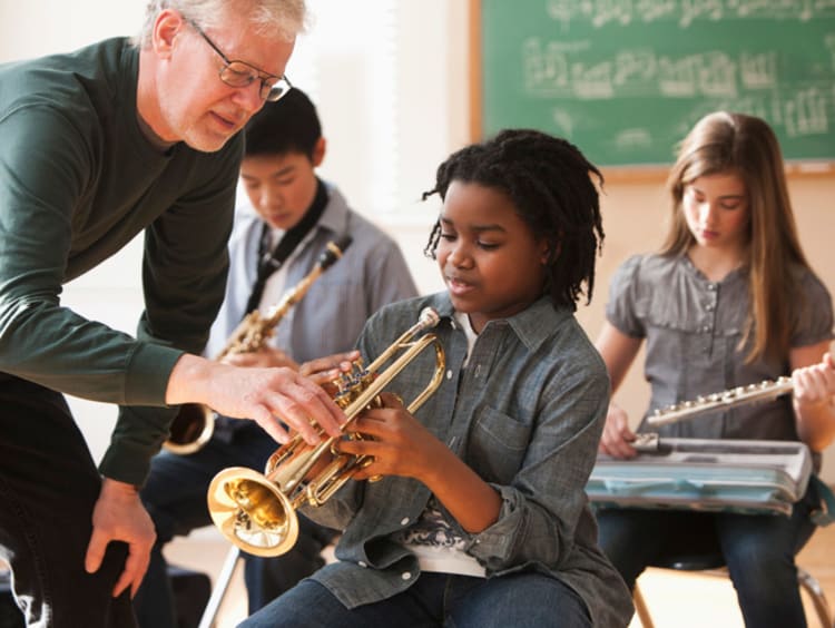 music teacher helping a student