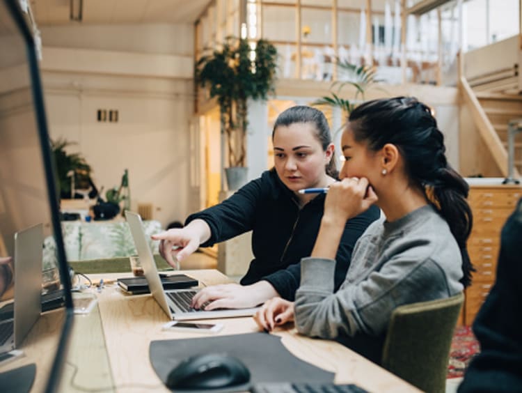 Digital designers collaborating in office