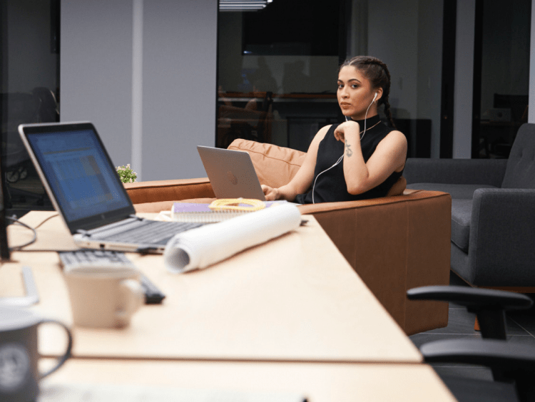 abandoned laptop alerts woman sitting close by