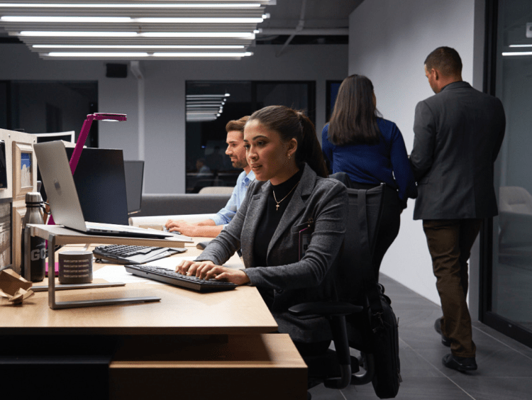 Employees work and discussion in office meeting setting