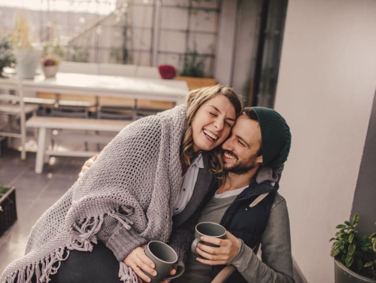 Couple sitting together on patio