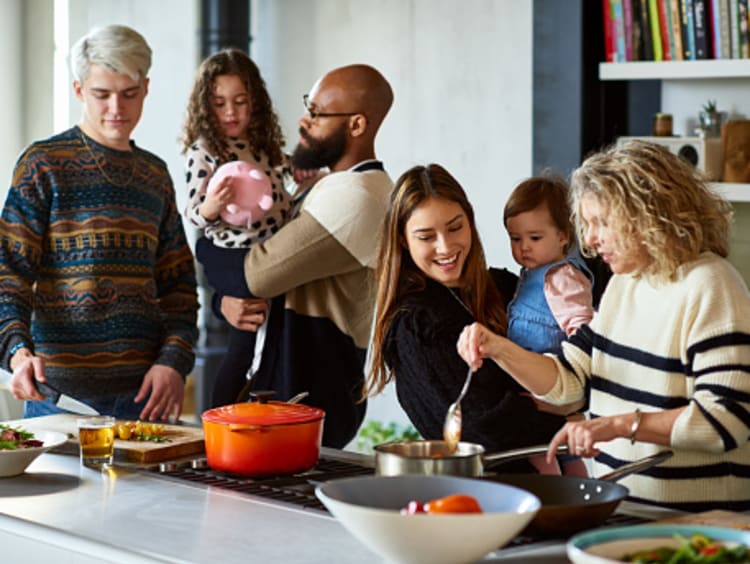 Generous host making meal for friends and family