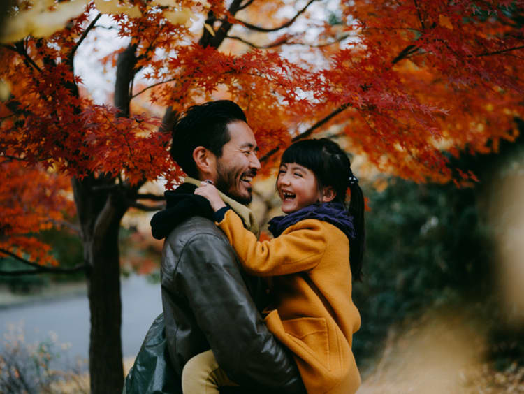 Father holding little girl in his arms