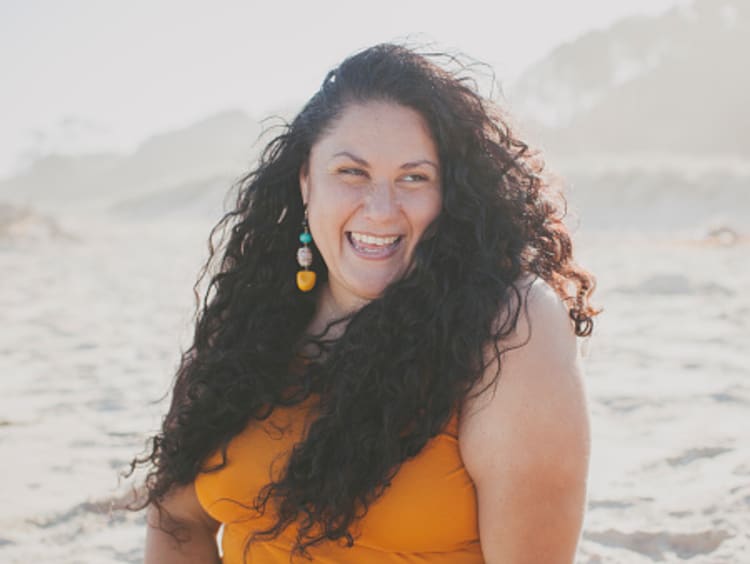 Smiling woman celebrating freedom in Christ