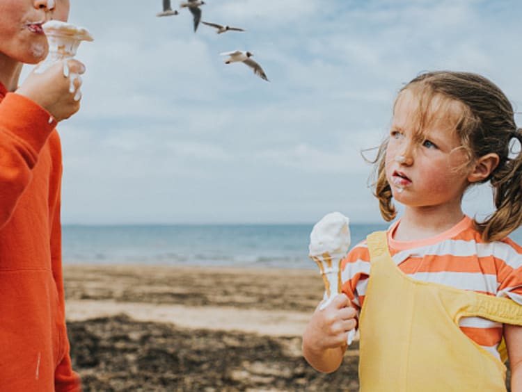 Little girl looking at big brother with resentment