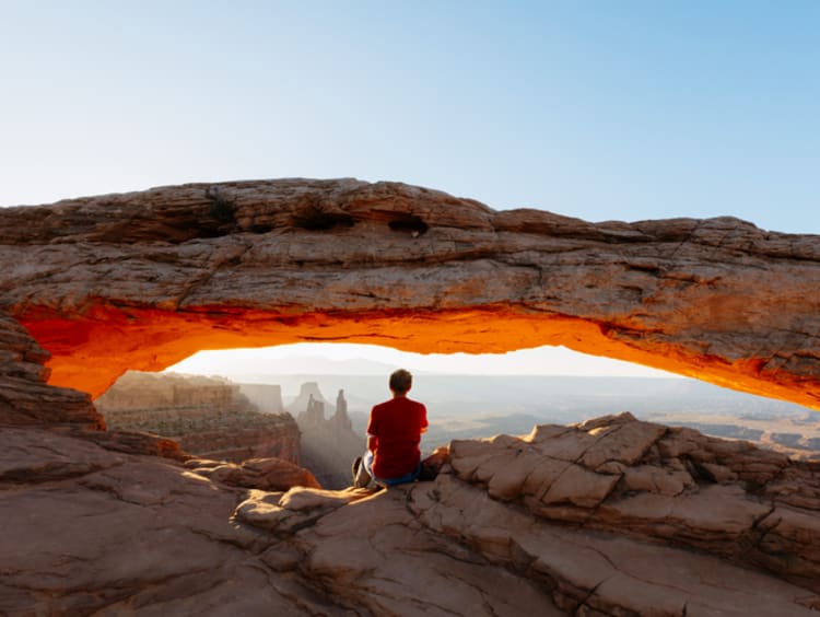 Man sitting in awe of God and the beauty of nature