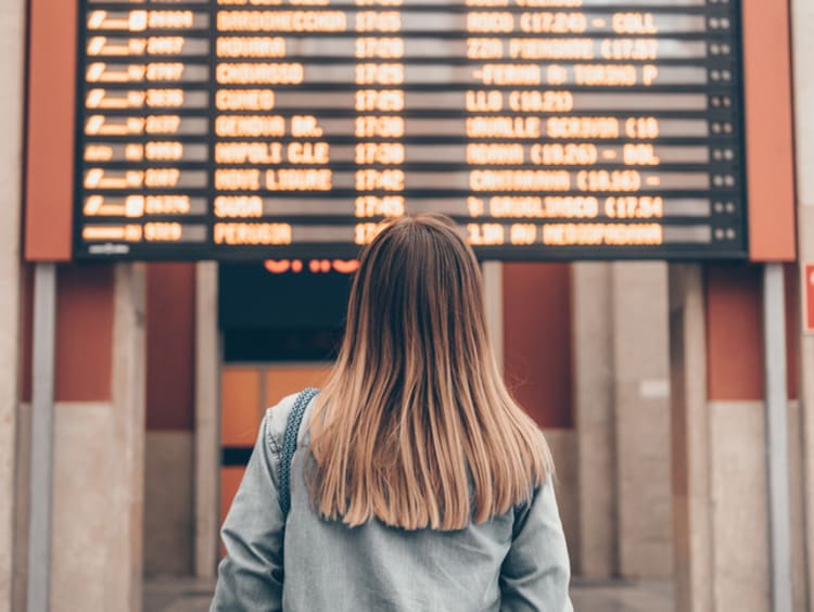 Woman patiently waiting at train station