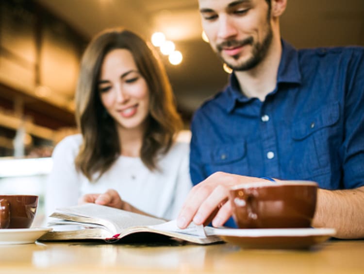 Couple prioritizing God in relationship and studying the bible