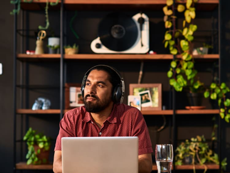 Man learning and growing from online educational course in home office